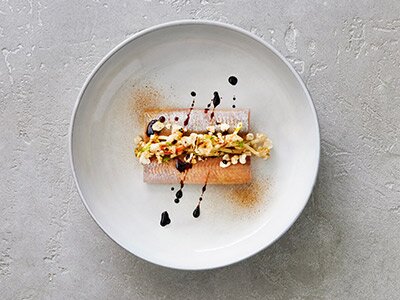 Herring with liquorice and crispy pork popcorn