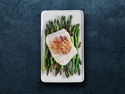 Norwegian Skrei on a bed of asparagus