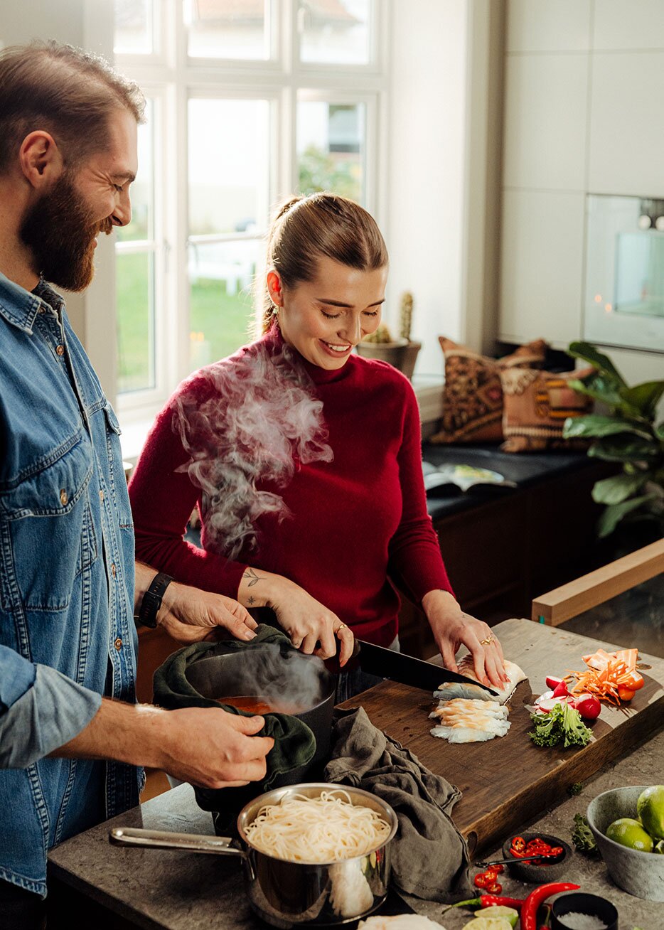 Couple cooking dinner